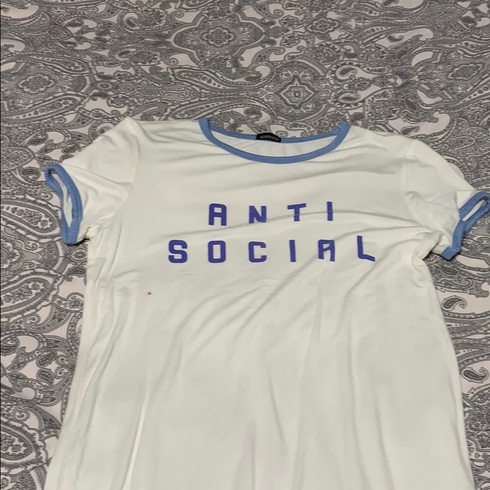 White and blue tee with small stain